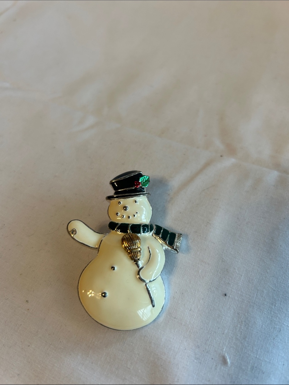 Source Unknown Ivory Snowman Brooch with Black Hat and Green Scarf